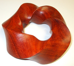 Torus Knot (3,5) Padauk wood, Figure 3 by Alex J. Feingold